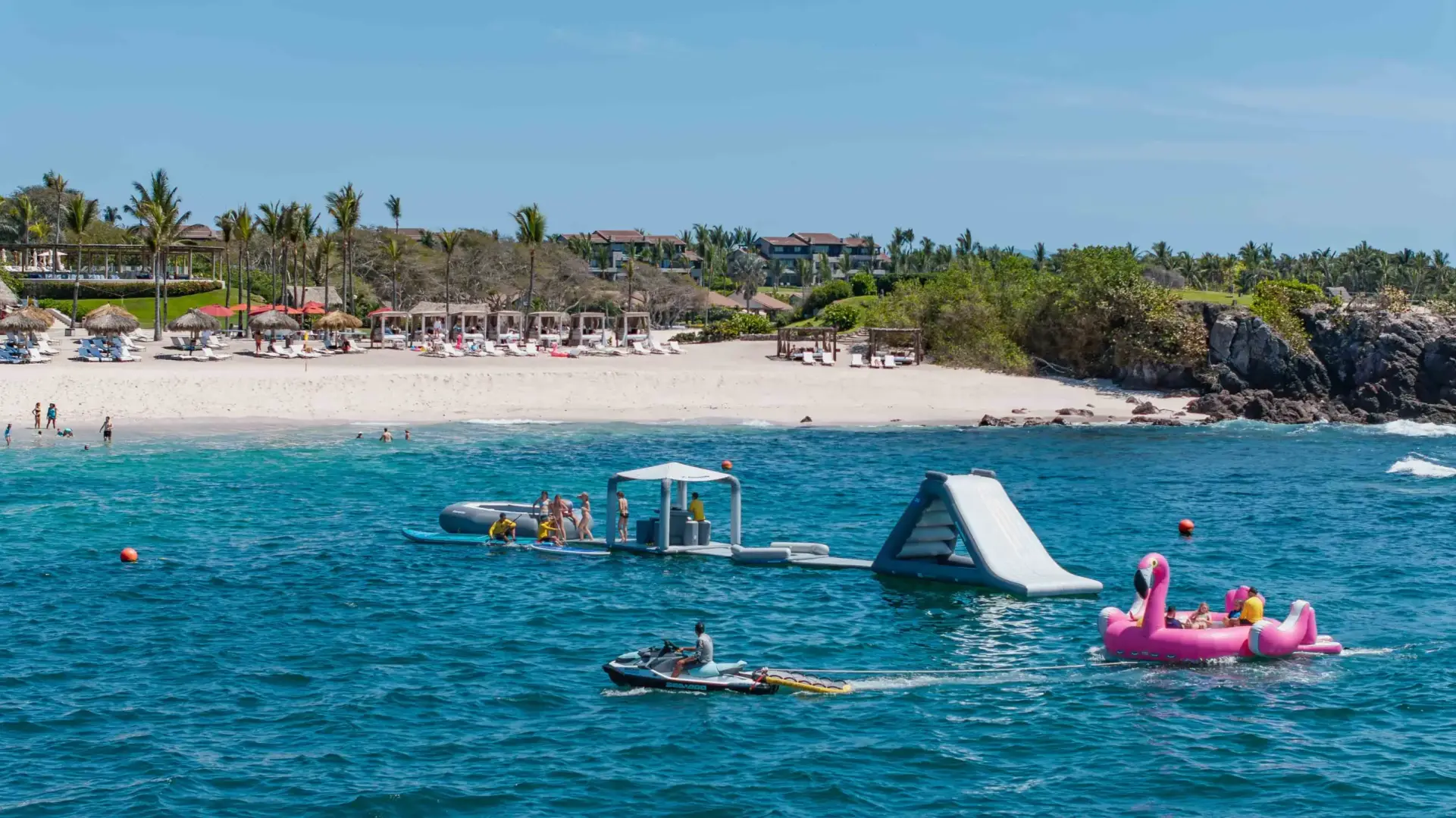 Family enjoying inflatable Pop Up Park – Surf Mexico Adventure on inflatable pop up park in Riviera Nayarit